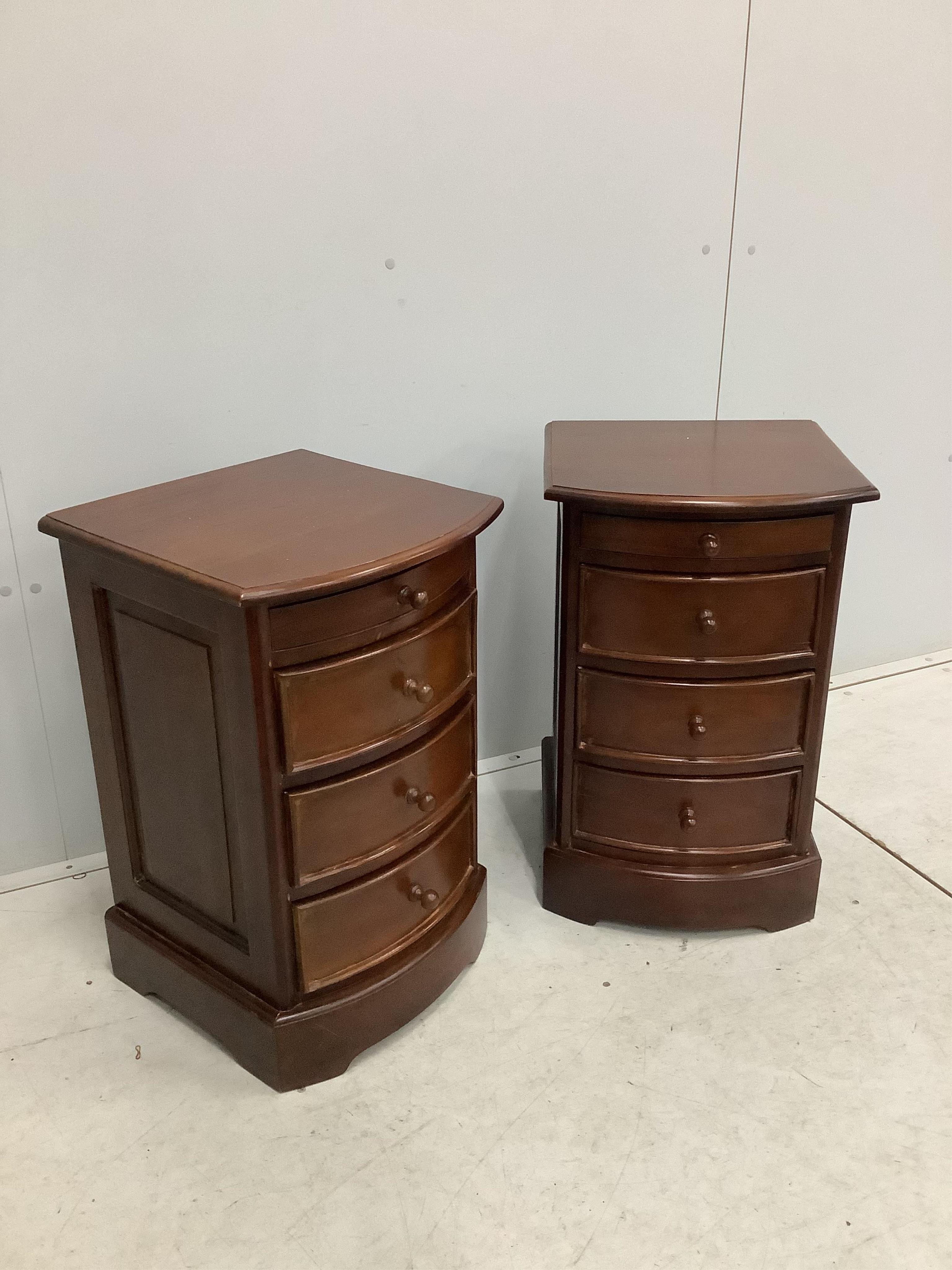 A pair of reproduction mahogany bow front four drawer bedside chests, width 42cm, depth 44cm, height 67cm. Condition - fair